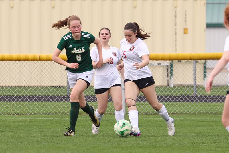 Bradley-Bourbonnais' Kali Andrews-Earling clears the ball under pressure from Bishop McNamara's Maggie Manes during the Boilermakers' 9-1 win over Bishop McNamara in All-City play on Tuesday, March 31, 2026.