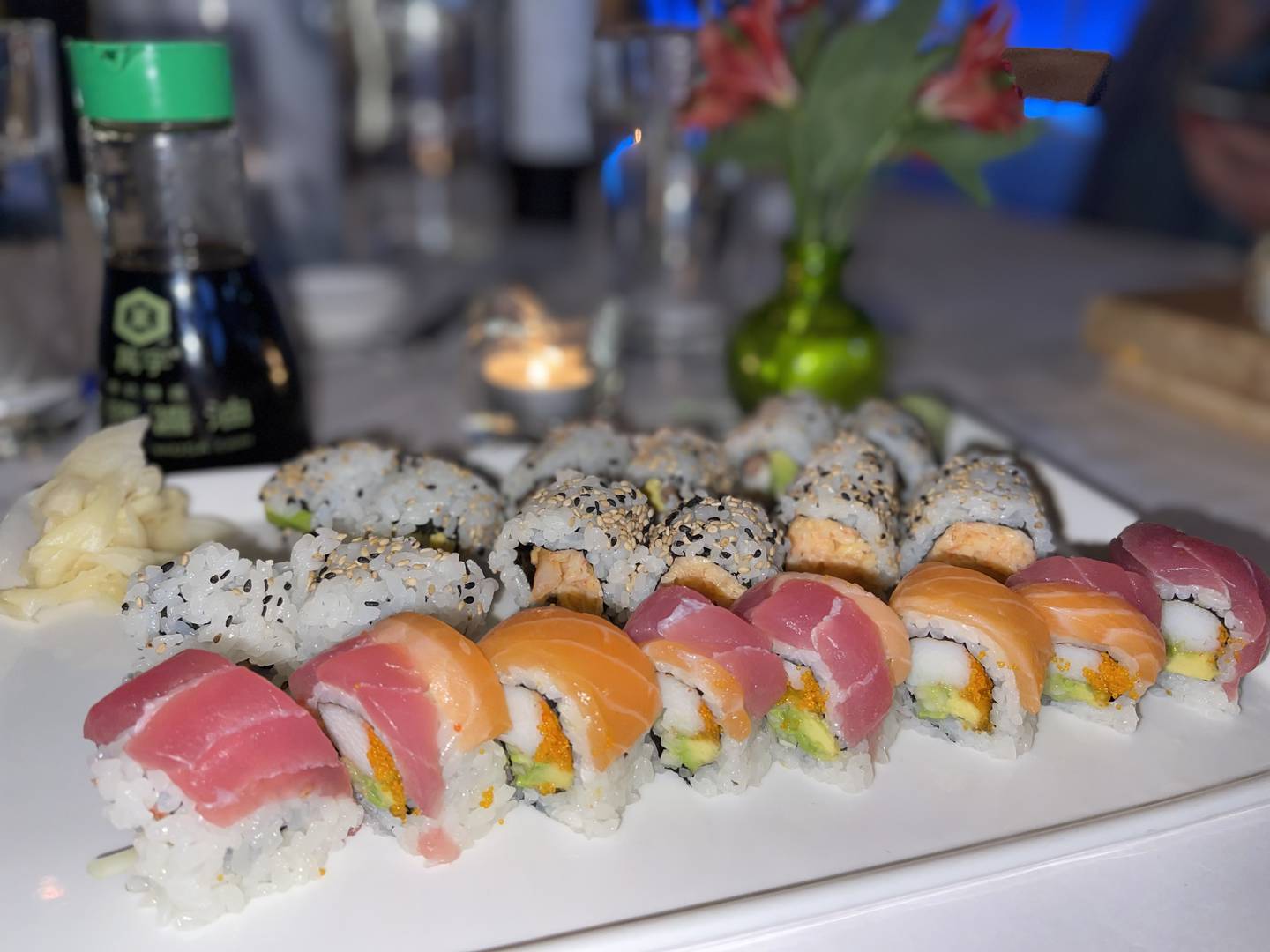 A platter of sushi and maki, Sapporo Roll, made with a spicy blend of crab and shrimp; Cancun Roll, cooked shrimp, pico de gallo and avocado; Rainbow Roll, crab, avocado, cucumber, masago, yellowtail and raw salmon and tuna.