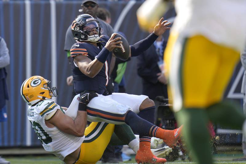 Green Bay Packers linebacker Lukas Van Ness tackles Chicago Bears quarterback Justin Fields during the first half, Sunday, Sept. 10, 2023, in Chicago.
