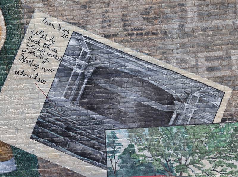 A detail of the mural titled “Its Merits Recommend It...” by artist Olivia Gude Tuesday, July 22, 2025. The artwork graces the side of the building at the corner of Lincoln Highway and First Street in DeKalb.