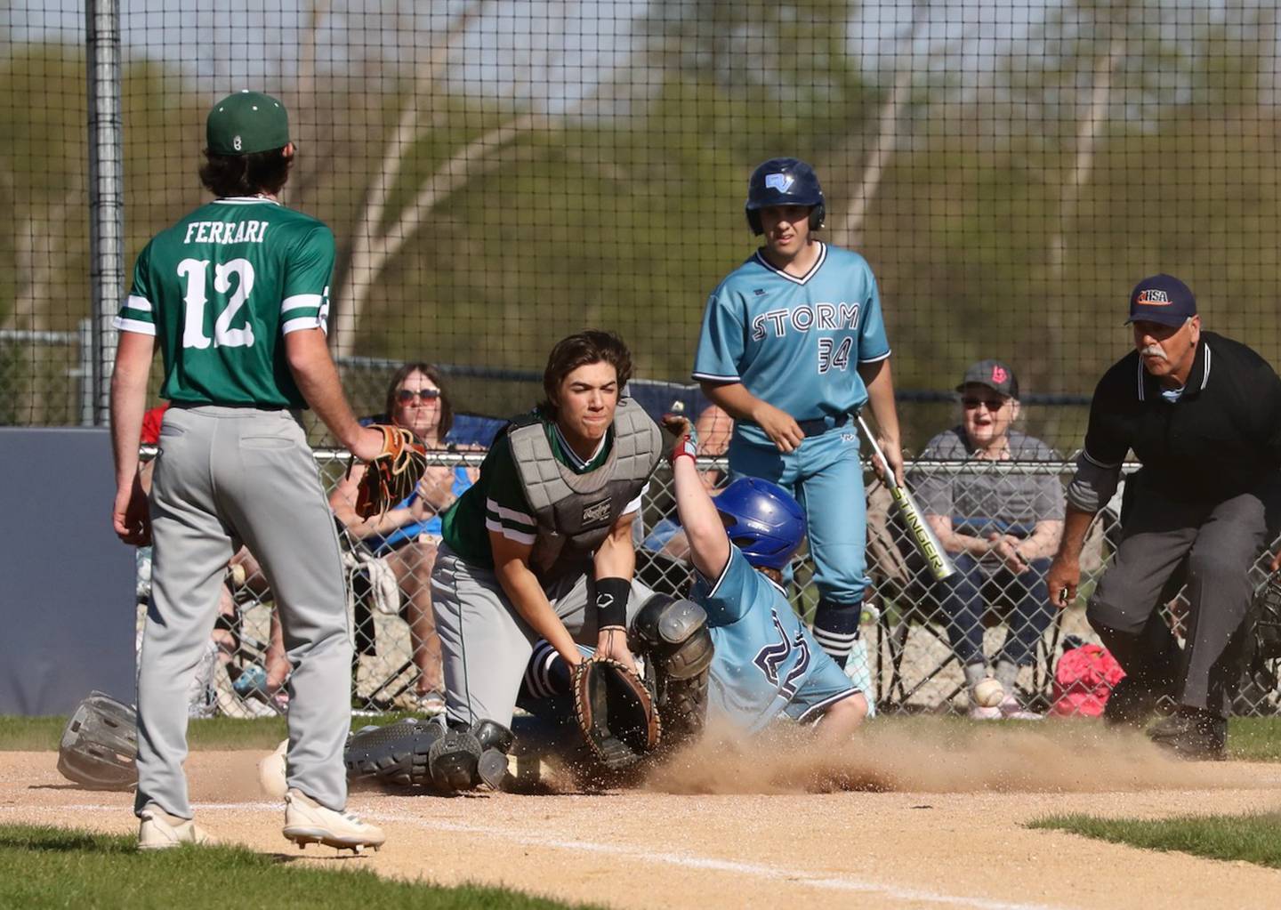 Bureau Valley's Elijah Endress (22) slides into home plate as St. Bede catcher Nate Husser waits for the throw on Thursday, May 4, 2023 in Manlius.