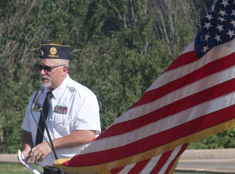 Dennis Znaniecki, commander of the Peru Veterans Memorial Group leads a Flag Retirement Ceremony on Friday, June 14, 2024 at Veterans Park in Peru.  The ceremony began as a Eagle Scout project for area boy scouts about 30 years ago. Boy Scouts from Peru's Troop 123 and Peru Cub Scouts from Pack 3709 were on hand to help with the ceremony. When an American Flag gets torn and tattered, Flag etiquette requires it to be proper disposed in a burning cauldron.