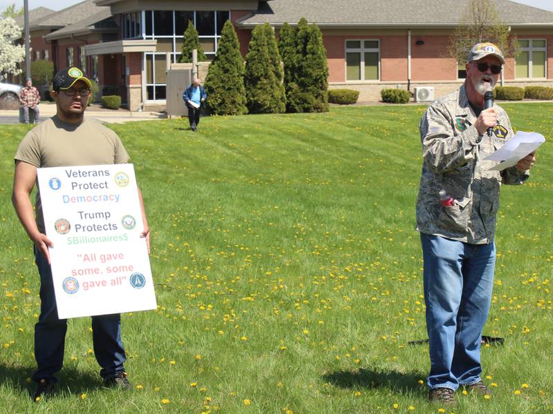 Illinois Veterans for Change Chair Jesse Rojo, left, and Air Force veteran Clay Erickson speak at a rally supporting Veterans Affairs April 27, 2025 in McHenry.