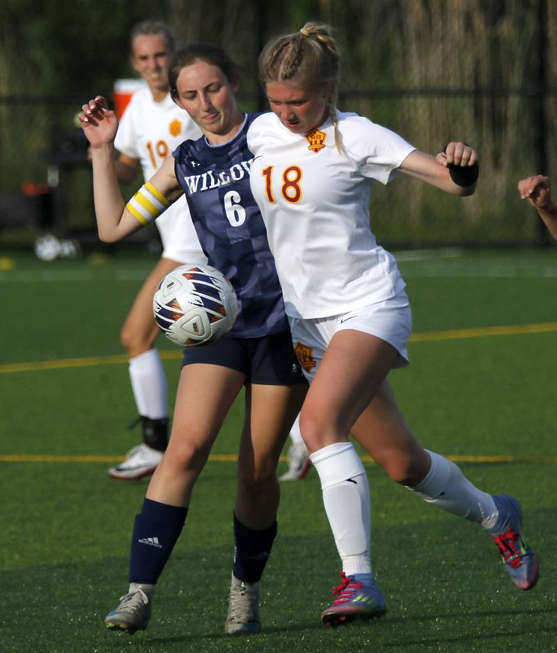 Willows Academy's Tess Anastasi battles with Richmond-Burton's Elle Barrettsmith for the ball during an IHSA Class 1A Cristo Rey St. Martin Sectional semifinal girls soccer match on Tuesday, May 26, 2026 at Cristo Rey St. Martin College Prep, in Waukegan.