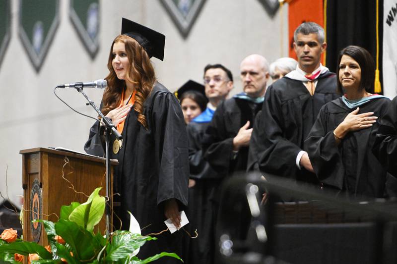 Wheaton Warrenville South senior Kaylynn Cahill recites the Pledge of Allegiance during the high school's graduation ceremony on Saturday, May 25, 2024 at the College of DuPage in Glen Ellyn.
