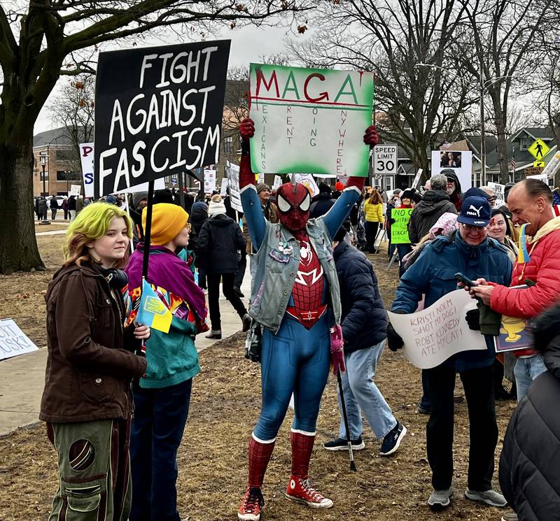 Drake Allen (Spiderman) protests the Trump administration's policies at Sterling's Grandon Civic Center on Friday, March 7, 2025.
