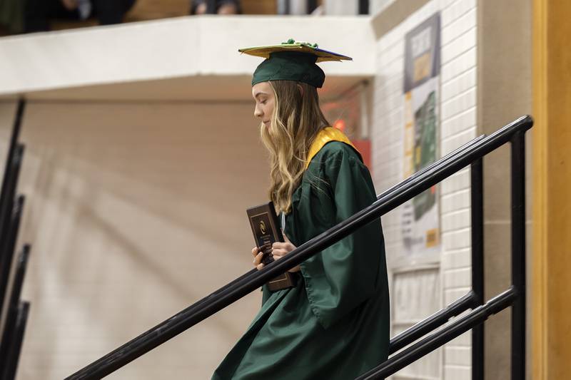 Salutatorian Carolyn Masini leaves the stage Sunday, May 18, 2025, after her speech during Rock Falls High School’s 2025 graduation.