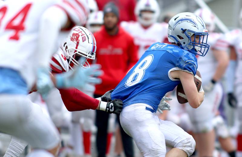 Woodstock’s JD Canty runs the ball against Ottawa in varsity football at Larry Dale Field on the campus of Woodstock High School Saturday.