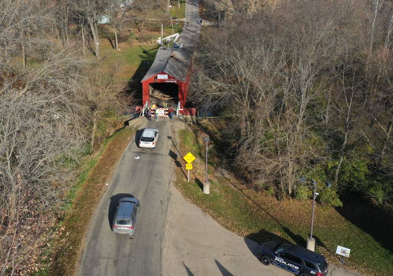 An aerial view of the damage of the Red Covered Bridge on Thursday, Nov. 16, 2023 in Princeton. Illinois Department of Transportation, Illinois State Police and Bureau County law enforcement survey the damage bridge after it was struck by a semi-truck.