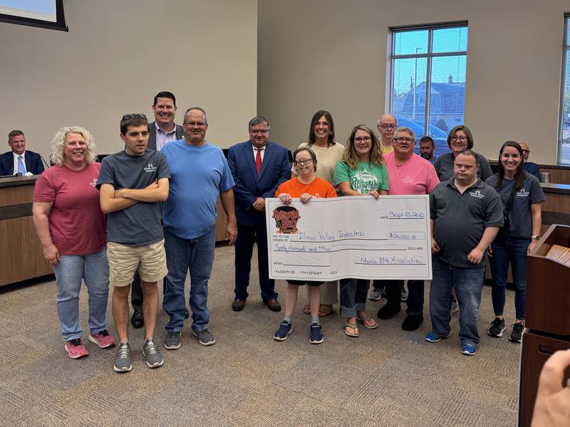 Employees and clients of Illinois Valley Industries with members of the Morris City Council and organizers of the Rhythm & BBQ Festival on Monday, Sept. 16, 2025.