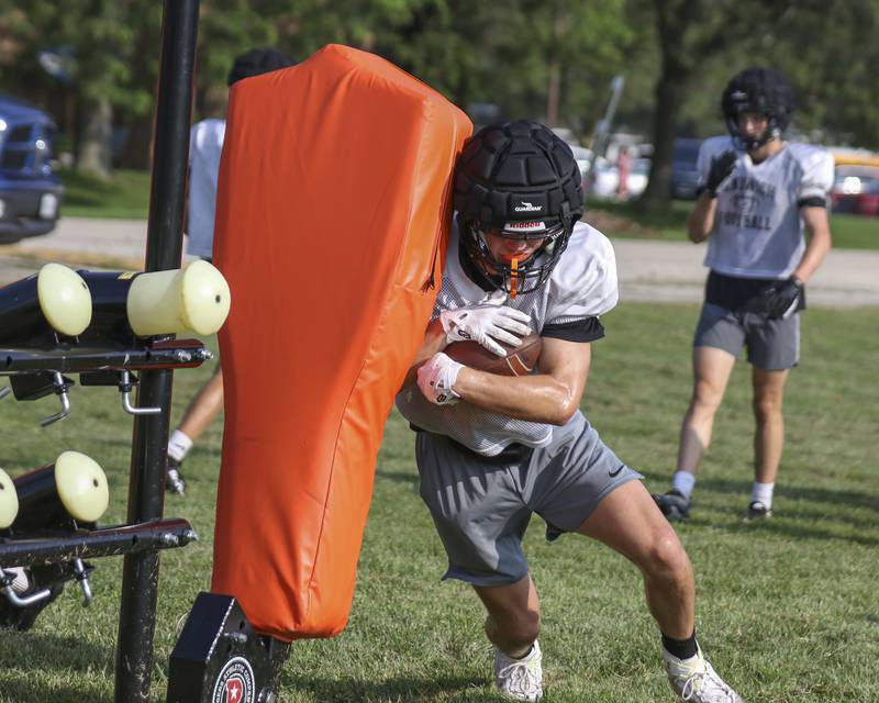 Nick Michalek participates in running back drills during Sandwich football practice Tuesday, July 22, 2025  in Sandwich.