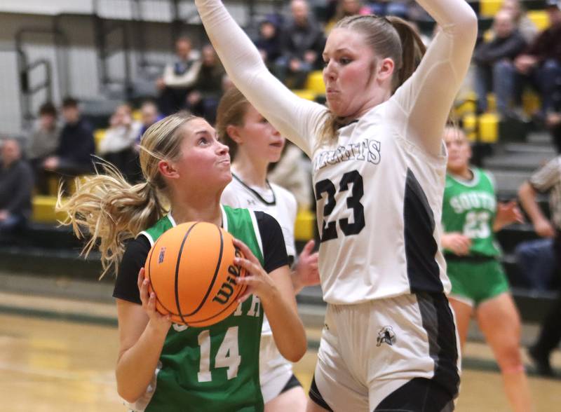 Crystal Lake South’s Makena Cleary, left, looks for a shot past Kaneland’s  Kendra Brown in IHSA Class 3A Regional Title Game girls basketball action on Friday, Feb. 21, 2025, at Crystal Lake South High School in Crystal Lake.