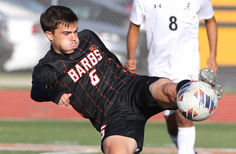 DeKalb's Landon Weishaar kicks the ball in front of Auburn's Jordan Jimenez during their game Thursday, Sept. 22, 2022, at DeKalb High School.