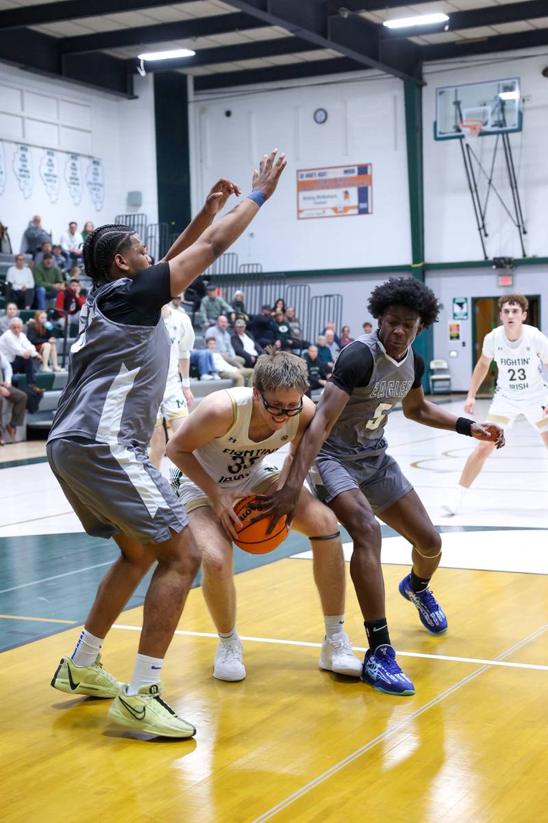 Bishop McNamara's Callaghan O'Connor is pressured in the lane during the Fightin' Irish's 70-51 loss to Hope Academy on Tuesday, Dec. 9, 2025