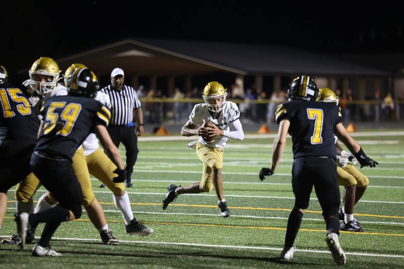 Bishop McNamara's Micah Lee looks to pass during the Fightin' Irish's 45-28 victory over Herscher on Friday, Sept. 5, 2025.