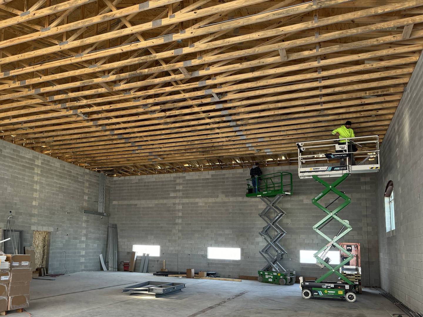 Construction workers inside the new Morris fire station at 200 Armstrong St.