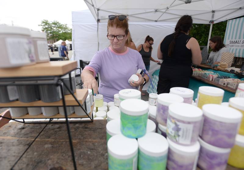 Danielle Farley of Oak Lawn picks out hand lotions while attending the annual La Grange Craft Fair Saturday July 12, 2025.
