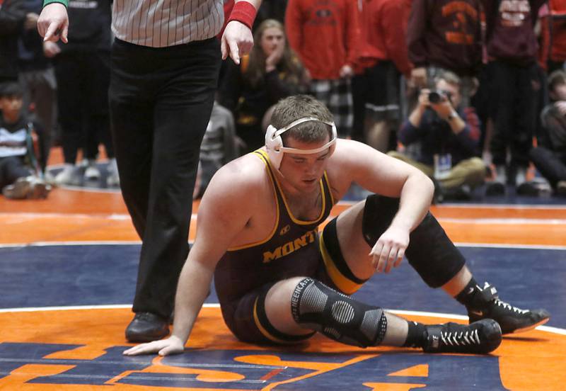 Montini's Mick Ranquist catches his breath after he was defeated by Washington's Sean Thornton during the 285-pound match during the IHSA Class 2A Dual Team Sate Championship match Saturday, Feb. 24, 2024 at Grossinger Motors Arena in Bloomington.