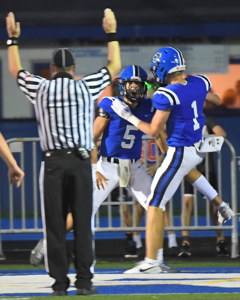 Lake Zurich’s Lucas Lappin, left, and teammate Jackson Piggott celebrate Lappin’s touchdown run against Warren in a football game in Lake Zurich on Friday, September 22, 2023.