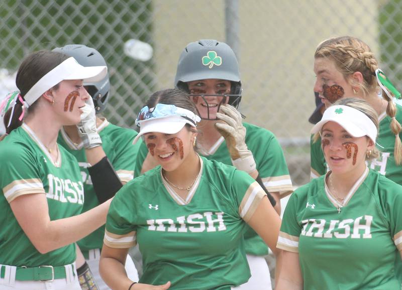 Seneca's Morgan Mercer (back middle) smiles after hitting a two-run homerun against St. Bede during the first inning on Monday, May 12, 2025 at St. Bede Academy.