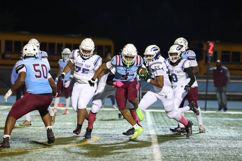 Kankakee's Davion White evades Bloom defenders during the Kay's victory over Bloom on Friday, Oct. 10, 2025.