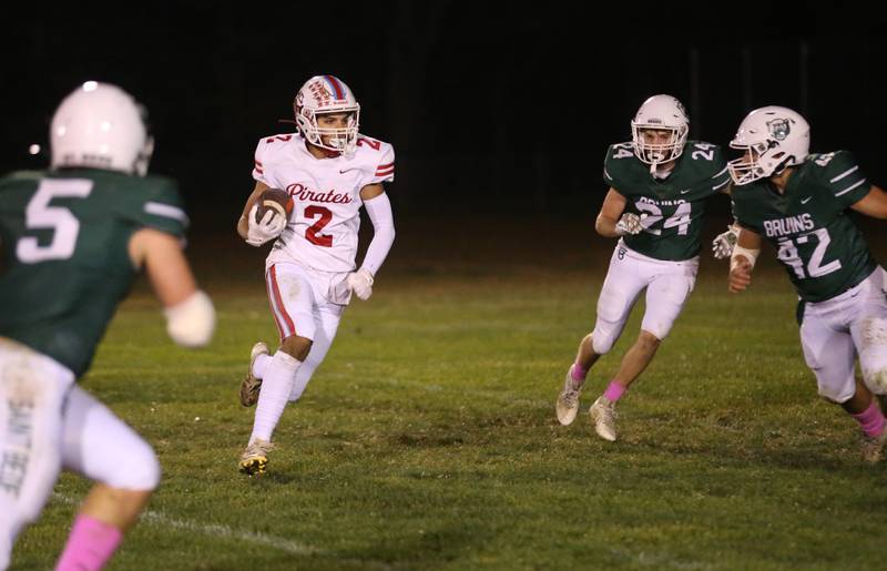 Ottawa's Andrew Vercolio cuts into St. Bede defenders Halden Hueneburg, Phillip Gray and Logan Pineda on a run on Friday, Oct. 25, 2024 at St. Bede Academy.