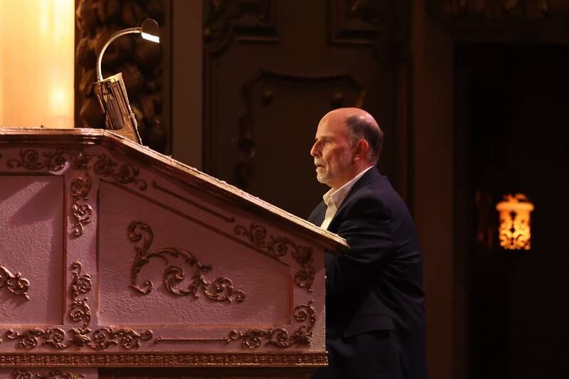Rialto organist Tylor Trimby plats the National Anthem during the Special Naturalization Ceremony held at the Rialto Square Theatre in downtown Joliet on Tuesday, April 23, 2024.