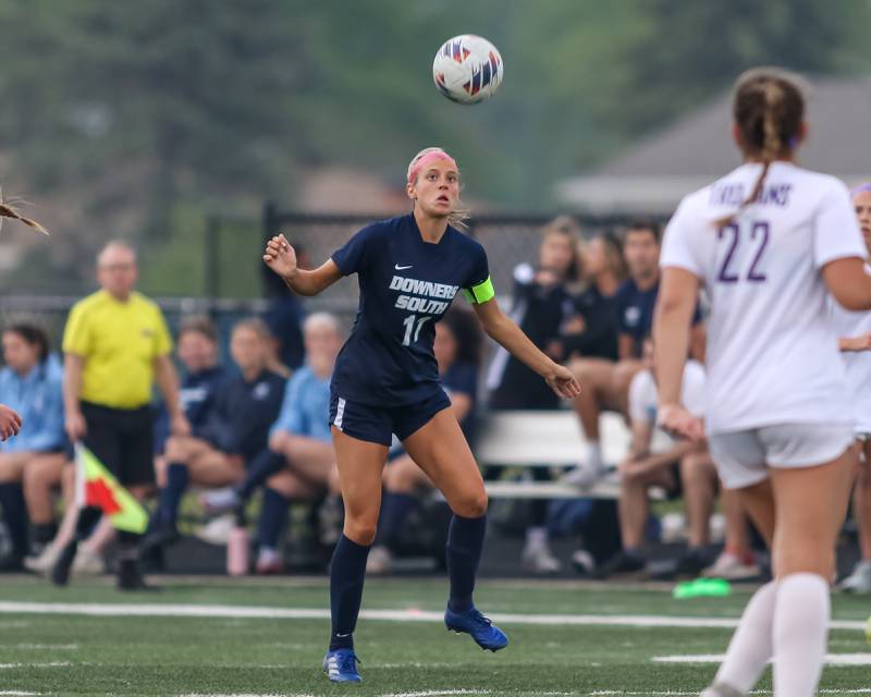 Downers Grove South's Grace Rappel (11) heads the ball during Class 3A Addison Trail Regional final soccer match between Downers Grove South at Downers Grove North.  May 19, 2023.