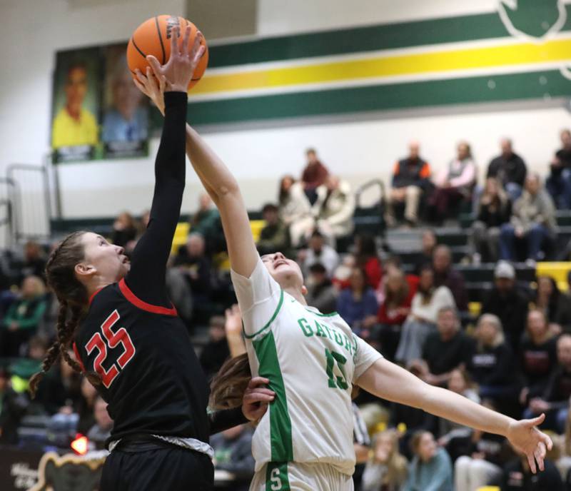 Huntley's Evelyn Freundt battles with Crystal Lake South's Tessa Melhuish for a rebound during a Fox Valley Conference girls basketball game on Friday, Jan. 30, 2026, at Crystal Lake South High School.