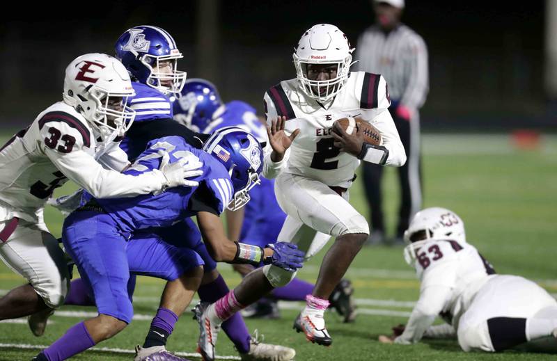 Elgin's Terrell Arrington (2) looks to move the ball during the annual crosstown rival game at Memorial Field  Friday October 14, 2022 in Elgin.