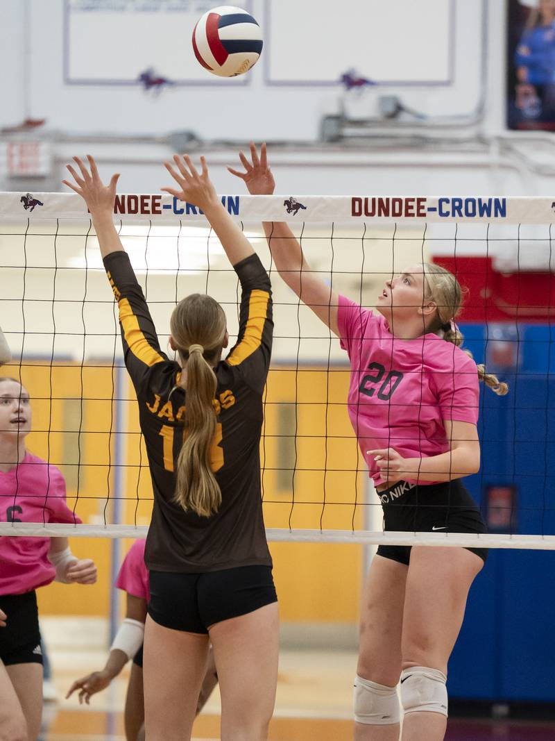 Dundee-Crown's Olivia Rodriguez, right, gets a ball over the net past Jacobs' Gracyn Sanders during their game on Thursday, October 16, 2025 at Dundee-Crown High School in Carpentersville. Ryan Rayburn for Shaw Local