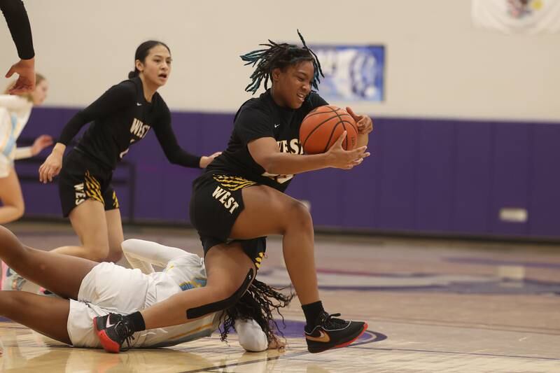 Joliet West’s Mariah Shelton gets the turnover against Joliet Catholic in the 2023 WJOL Girls Basketball Tournament on Friday, Nov. 17, 2023, in Joliet