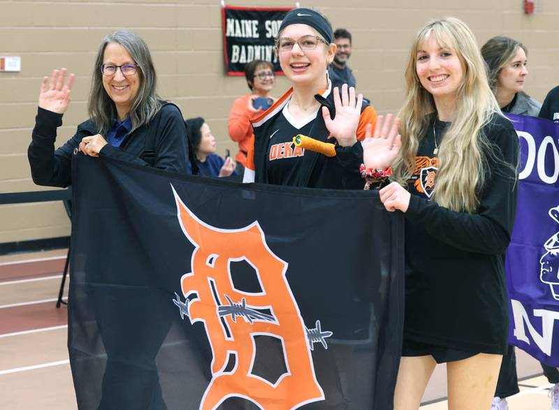 The DeKalb badminton contingent walks in the parade of teams Friday, May 10, 2024, prior to the IHSA State Badminton Finals at DeKalb High School.