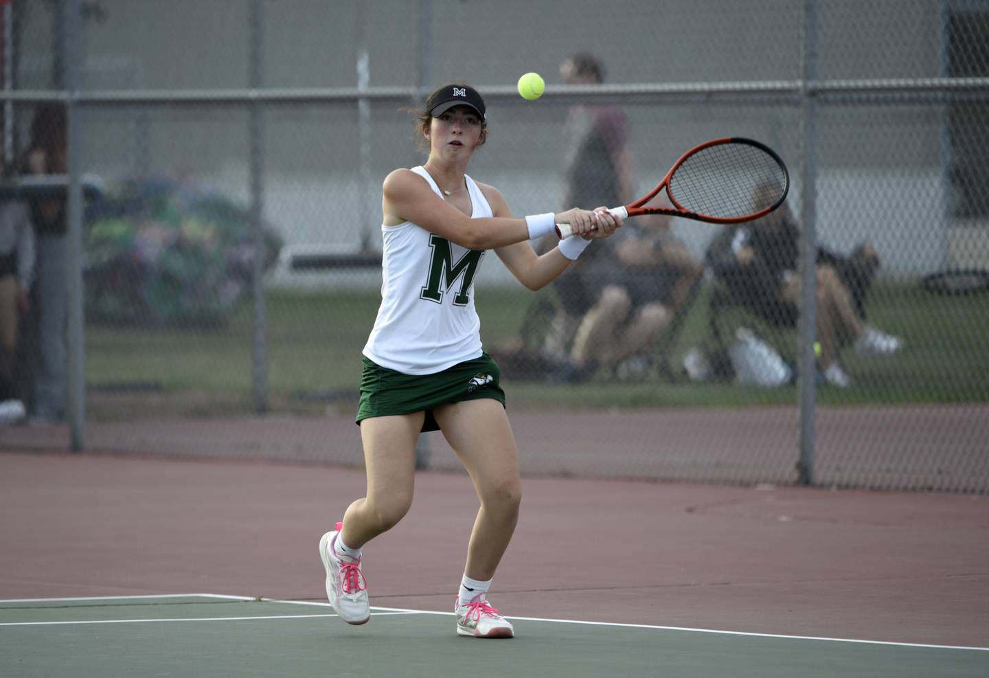 Bishop McNamara's Emily Cox returns a hit in the third place singles match of the All-City tournament against Bradley-Bourbonnais on Wednesday, October 1, 2025.