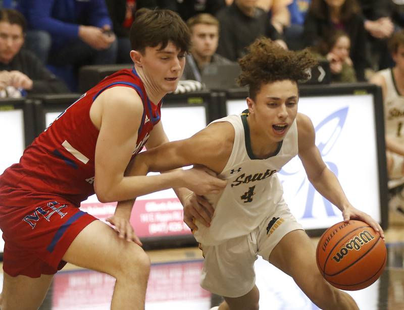 Crystal Lake South's AJ Demirov drives to the basket against Marmion’s Evan Stumn during a IHSA Class 3A Sectional boys basketball game Tuesday, Feb. 28, 2023, at Central High School in Burlington.