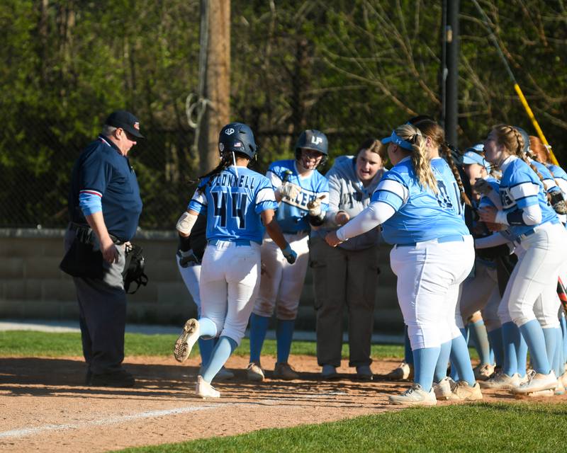 Lake Park's Ariana O'Connell (44) gets congratulated by her teammates after hitting a home run during the game against St. Charles North on Wednesday April 24, 2024, held at Lake Park High School.