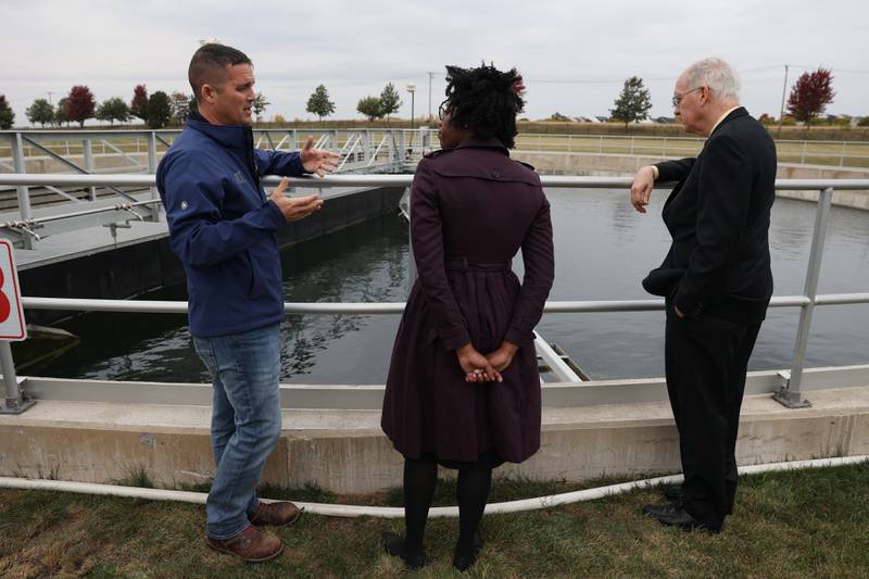 Nick Gornick, Deputy Director of Plant Operations, left, talks with Congresswoman Lauren Underwood and Congressman Bill Foster and at the City of Joliet Aux Sable Wastewater Treatment Plant during a press conference announcing new funding from the Bipartisan Infrastructure Law for the state of Illinois on Tuesday.