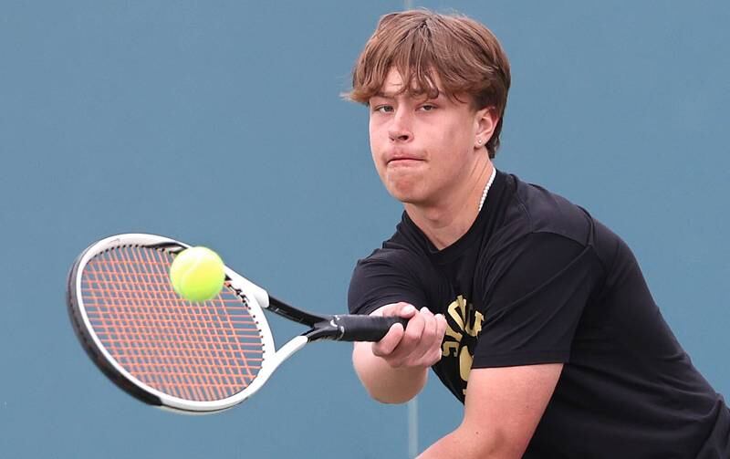 Sycamore’s Jonathan Locascio hits a forehand during his number one doubles match along with partner Liam Kerbel against Dixon Thursday, March 30, 2023, at Sycamore High School. This is the inaugural season for the Sycamore boys tennis team.