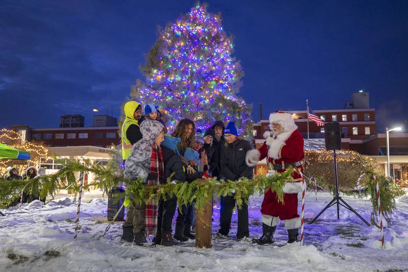 Members of the Reyes family light the Christmas tree Friday, Dec. 5, 2025, at OSF to kick off Dixon’s Christmas Walk. Enzo Reyes, 5, had the honors of pressing the button.