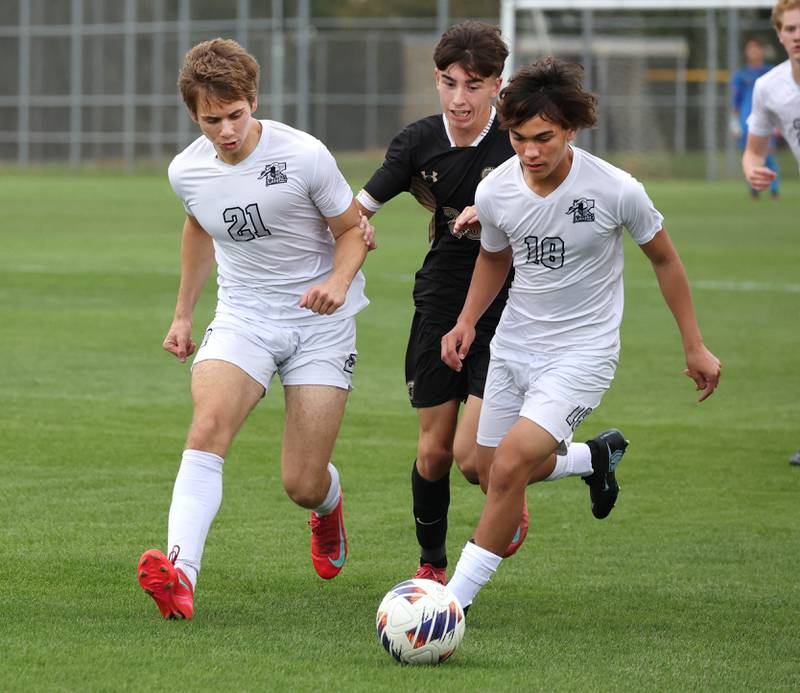 Sycamore's Leo Padilla tries to get between Kaneland's Jackson Boryc (left) and Dylan Pilz during their game Monday, Oct. 6, 2025, at Sycamore High School.