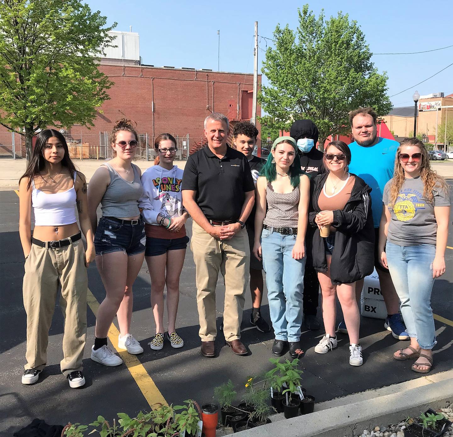 Pictured: DeKalb Mayor Cohen Barnes (middle) thanking DeKalb High School horticulture students who participated in the downtown planting on Friday, May 13.