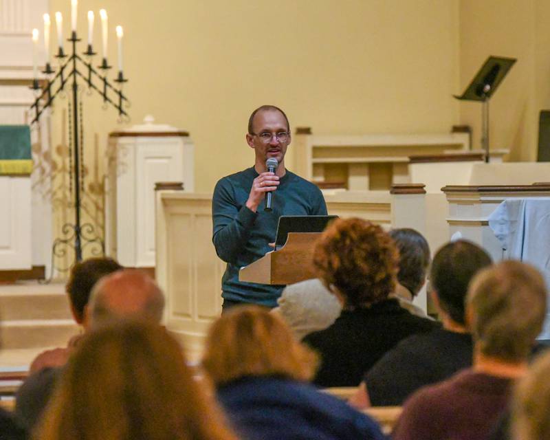 The Rev. Eric Ogi of the Federated Church of Sycamore speaks about a call to action during a prayer vigil for peace in Israel and Palestine on Tuesday, Nov. 21, 2023, held at the First Congregational United Church of Christ in DeKalb.