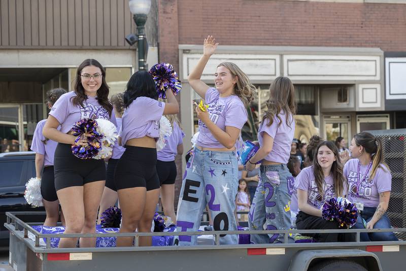 Dixon dance squad members ride through the homecoming parade Friday, Oct. 3, 2025.