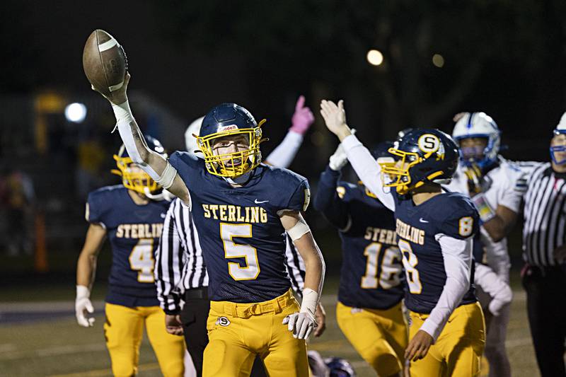 Sterling’s Sterling’s Gavin Church comes up with a fumble against Quincy Friday, Oct.6, 2023 in Sterling.