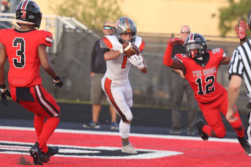 Minooka’s Connor Christensen pulls in a pass for a touchdown against Bolingbrook. Friday, Aug. 26, 2022, in Bolingbrook.