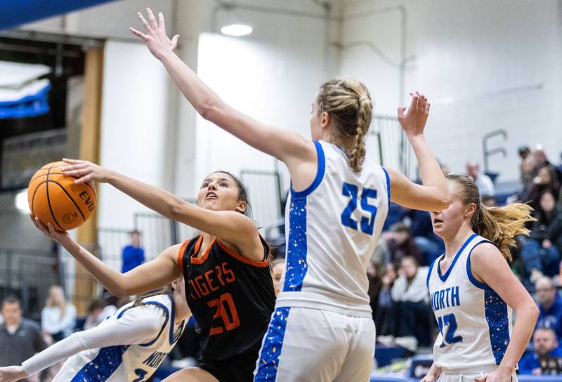 Wheaton Warrenville South’s McKenna Bloodworth goes up for a layup during a game against Wheaton North on Friday, Dec. 20, 2024.