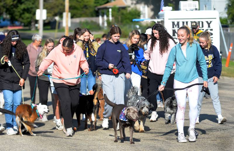 Polo High School students and others start the 2025 Doggy Dash on Saturday, Sept. 6, 2025. The event raised money for a local animal shelter.