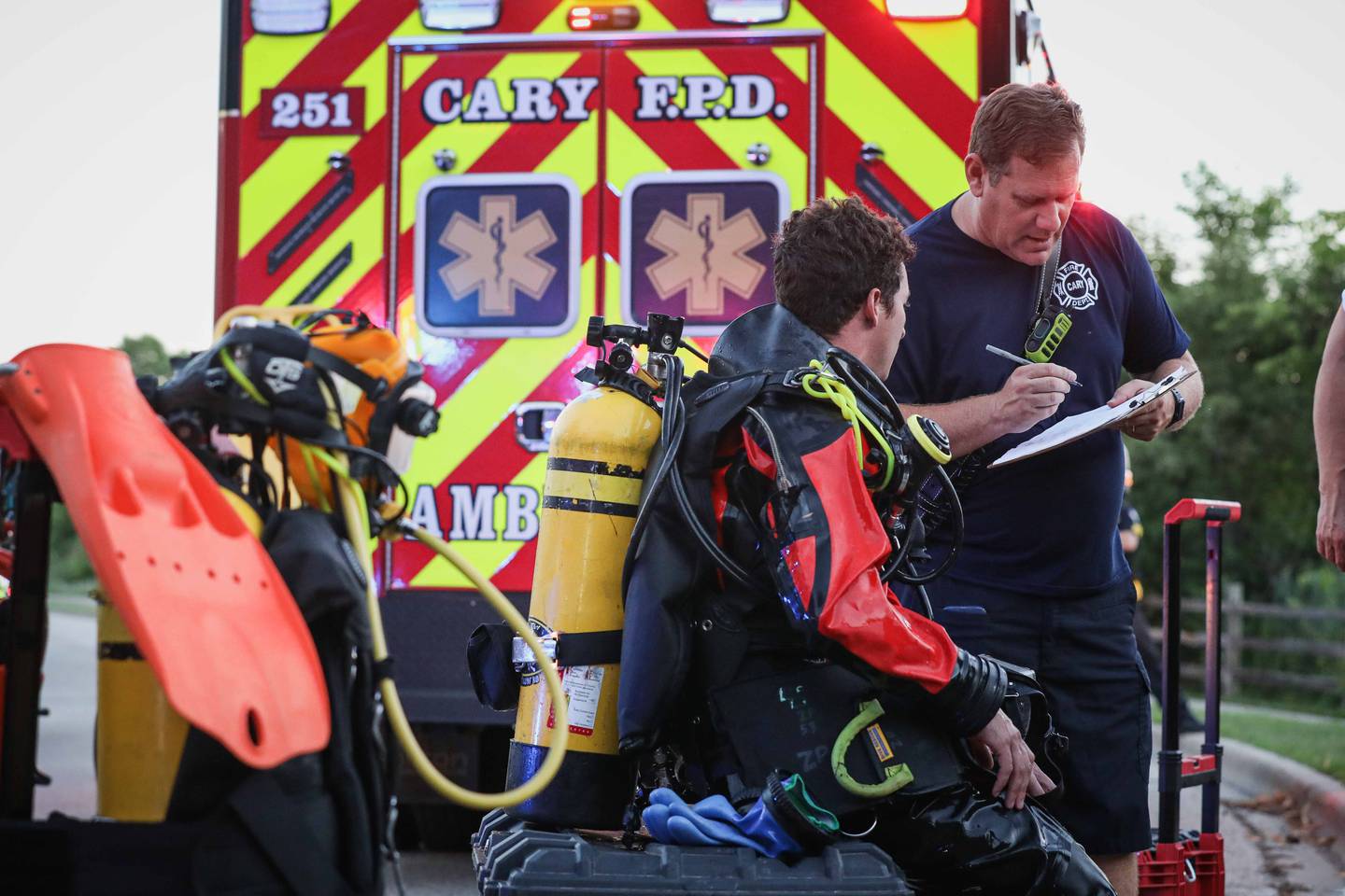 First responders work a scene in Cary on July 28, 2025, where a car went into a pond.