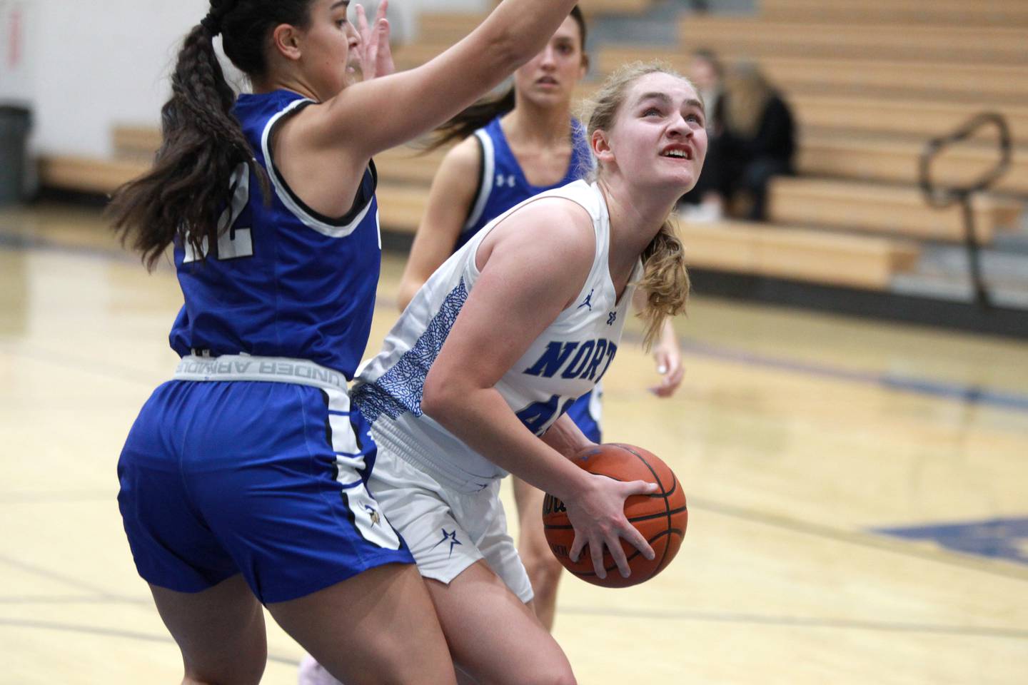 St. Charles North’s Elle Fuhr (right) attempts a shot around Geneva’s Leah Palmer during a game at St. Charles North on Tuesday, Jan. 9, 2024.