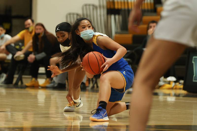 Joliet Central’s Lillian Luangsomkham looks to pass out of trouble against Joliet West. Tuesday, Feb. 8, 2022, in Joliet